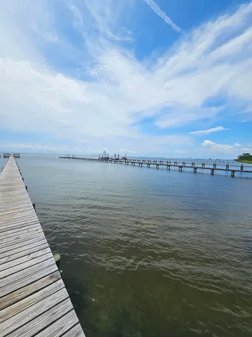 a view of roof deck with two chairs