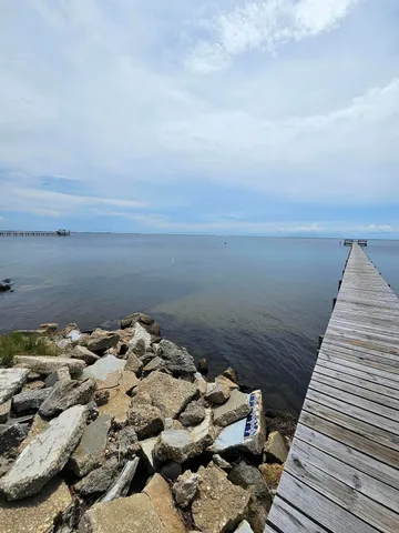 a view of a big yard with a large mountain view