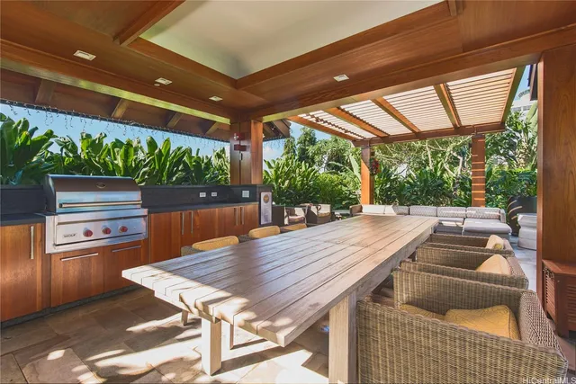 a wooden table and chairs in a patio