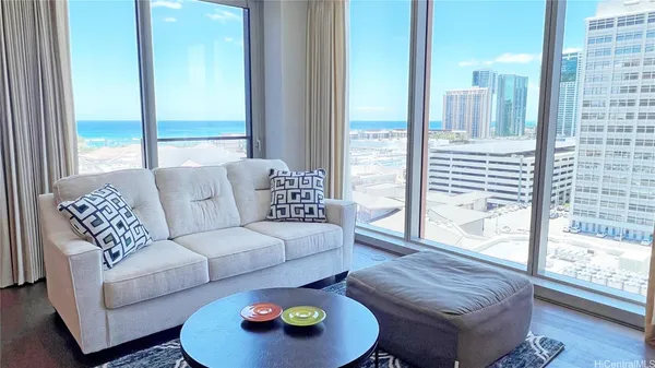 a living room with furniture and a large window