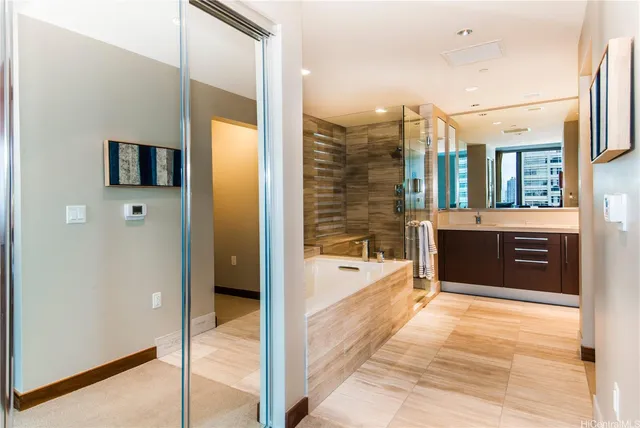 a spacious bathroom with a tub and a shower