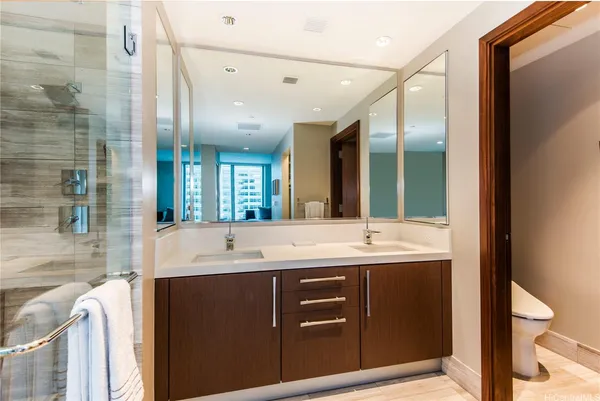 a bathroom with a double vanity sink and a mirror