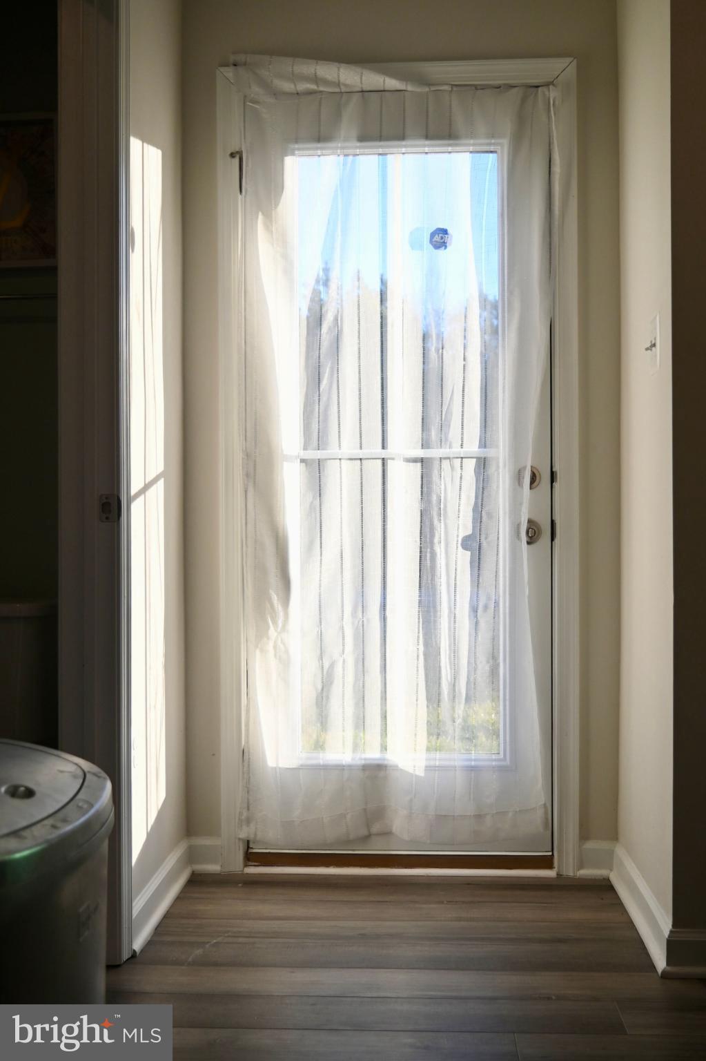 110 Mariners Way Cambridge, MD 21613 - Photo 14 of 41 Sunlit doorway inviting the outdoors in.