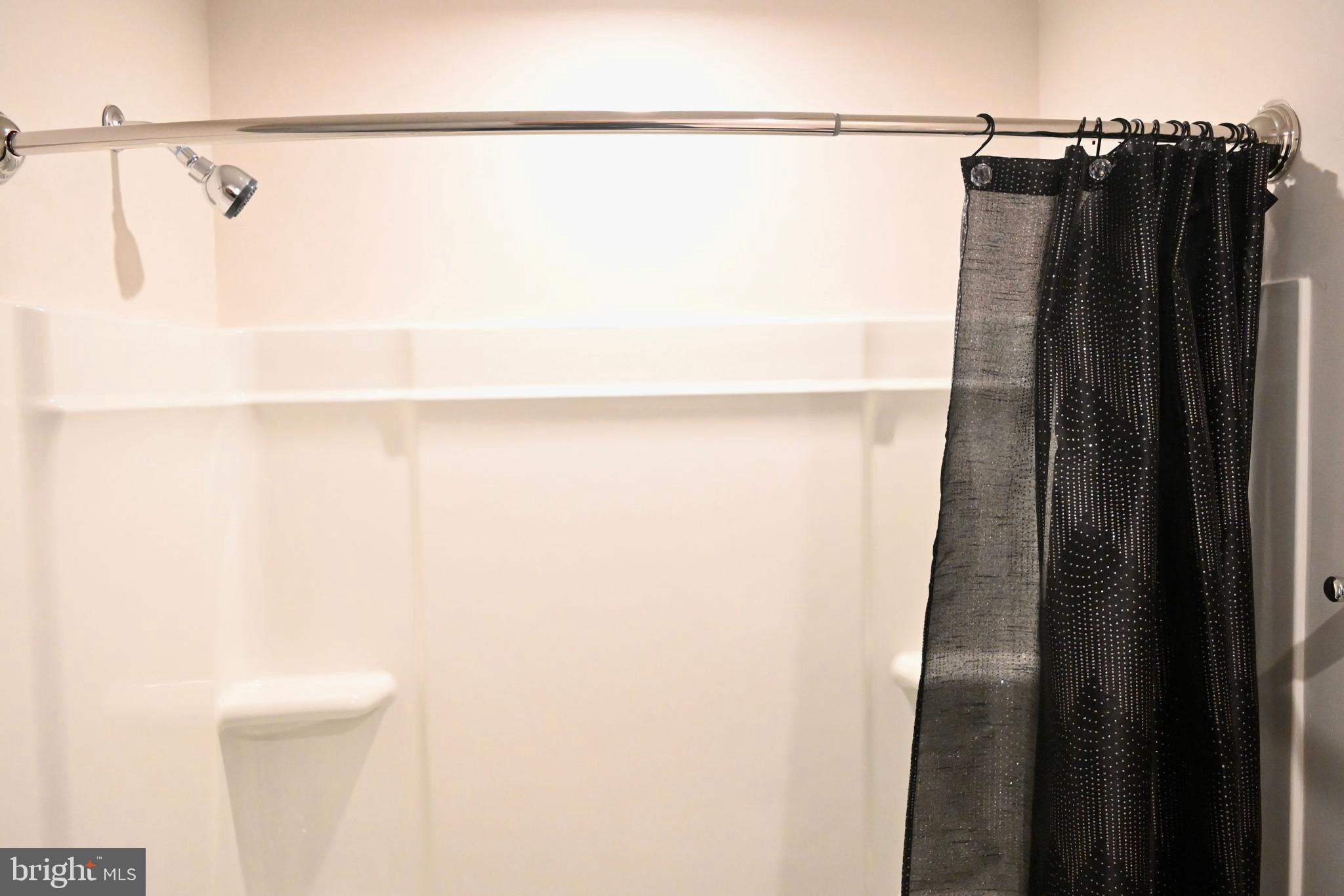 110 Mariners Way Cambridge, MD 21613 - Photo 32 of 41 Sleek shower space with modern accents.