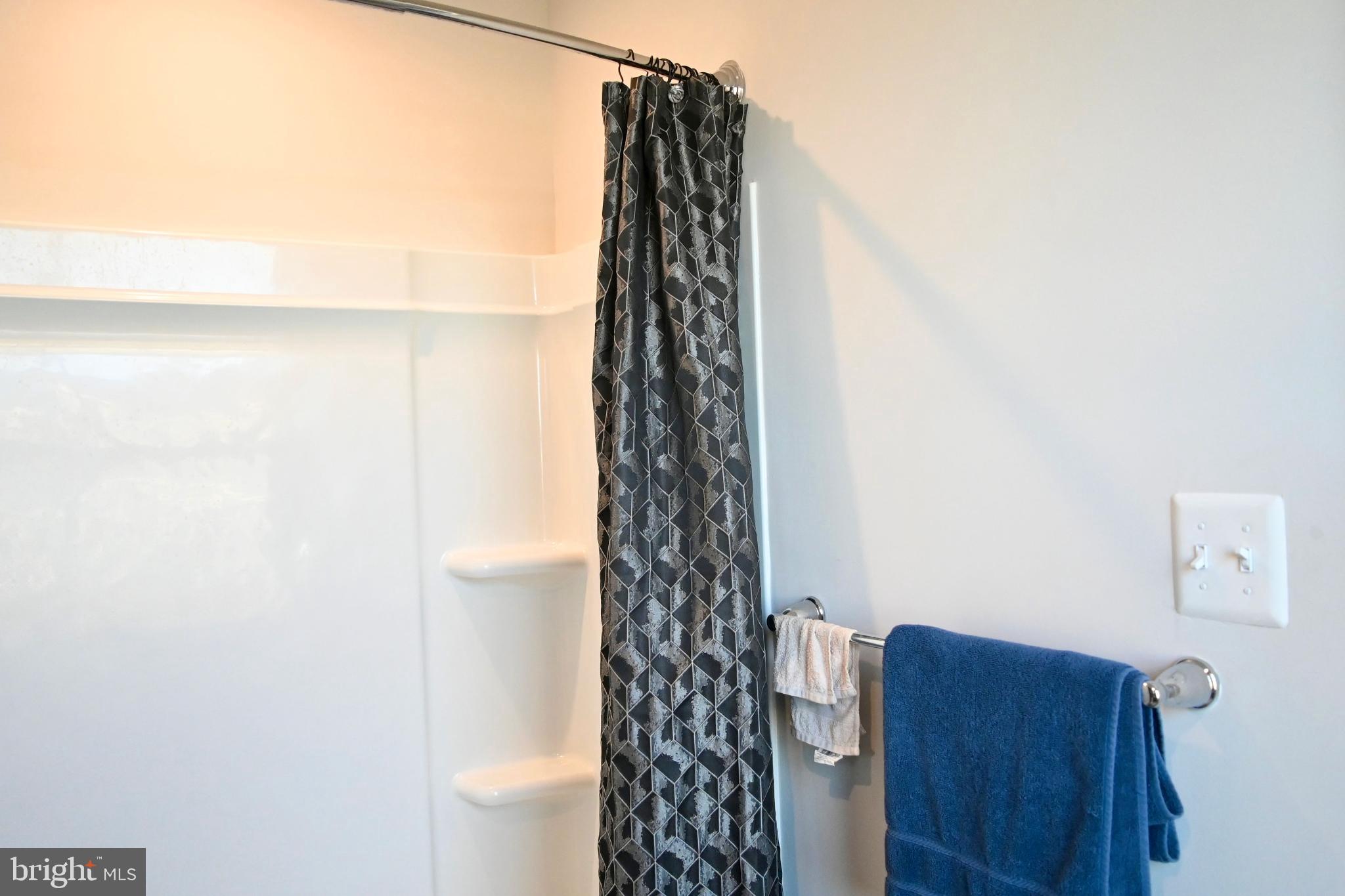 110 Mariners Way Cambridge, MD 21613 - Photo 35 of 41 Modern bathroom with stylish shower curtain.