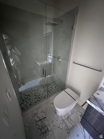 1918 Chimney Rock Road Heber City, UT 84032 - Photo 66 of 74 Glass-enclosed shower with pebble-tile floor and square rain shower head