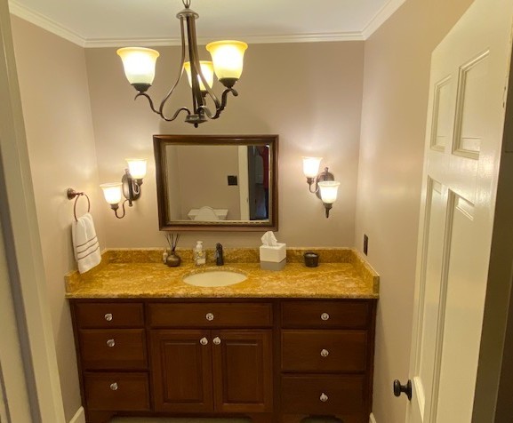 292 High Street Morrison, TN 37357 - Photo 22 of 39 a bathroom with a granite countertop sink a mirror and shower view