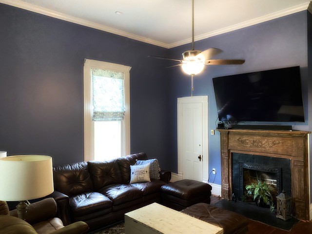 292 High Street Morrison, TN 37357 - Photo 10 of 39 a living room with furniture a flat screen tv and a fireplace