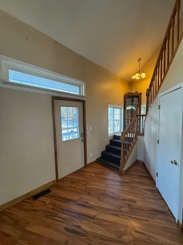 a view of a livingroom with furniture and a window