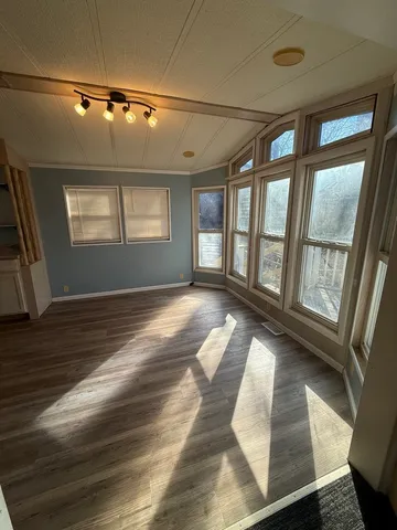 a view of a hallway with a kitchen
