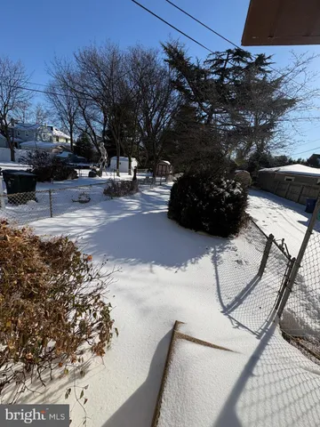 a view of a yard with cars