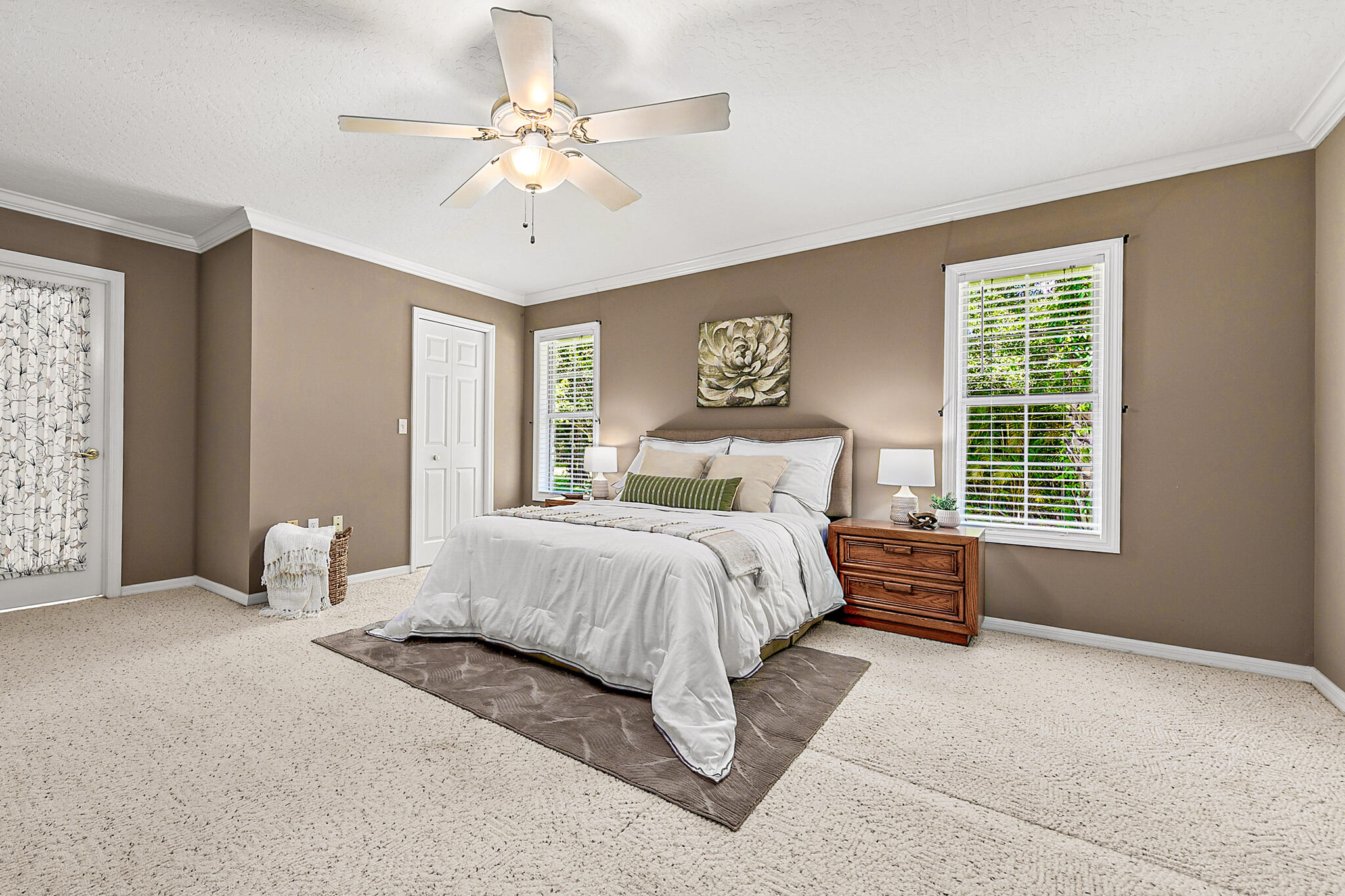 3240 Weber Road Malabar, FL 32950 - Photo 25 of 47 a bedroom with a large bed and a chandelier