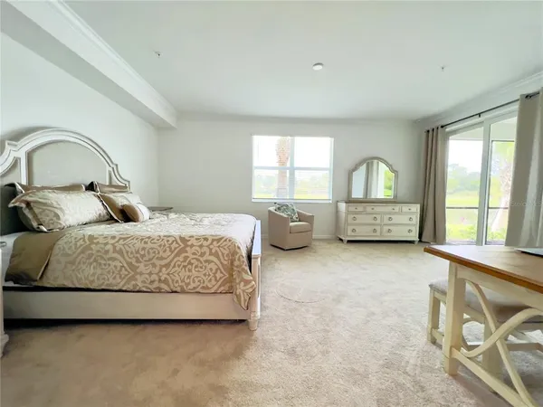 a spacious bathroom with a shower sink and mirror