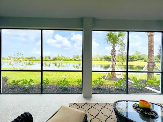 a view of a house with swimming pool and porch with furniture