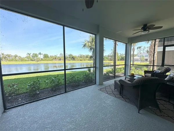 a front view of a house with porch and outdoor seating
