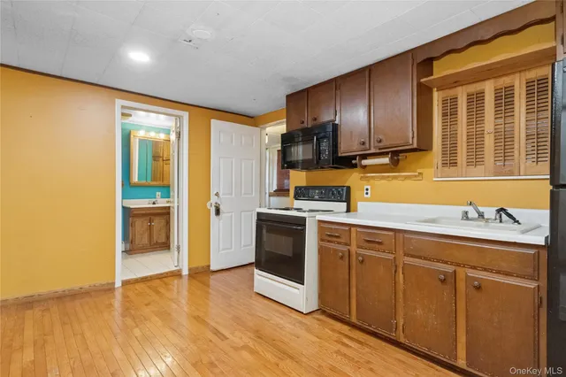 a kitchen with stainless steel appliances granite countertop a stove and a sink