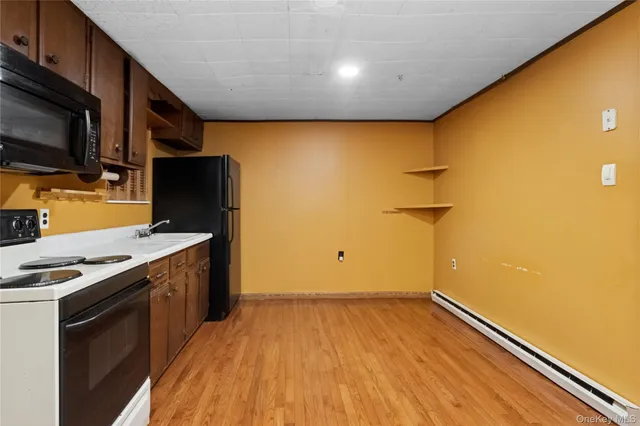 a view of a kitchen with a sink and a microwave