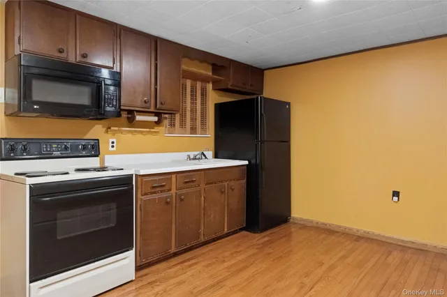 a kitchen with a stove microwave and refrigerator
