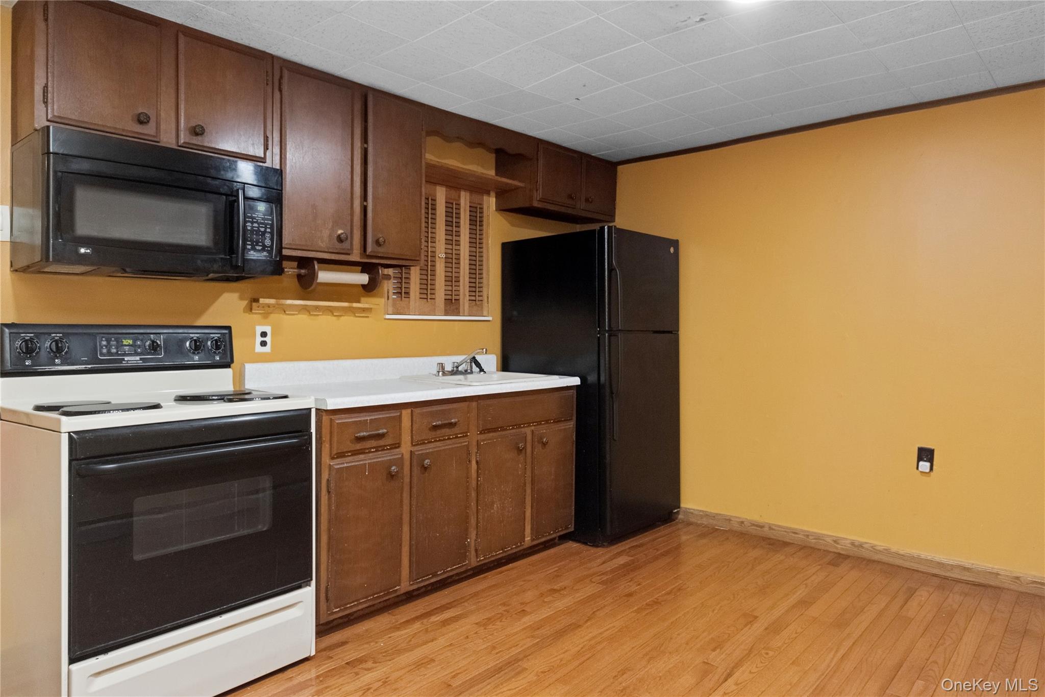 35 Fallkill Avenue Poughkeepsie, NY 12601 - Photo 13 of 27 a kitchen with a stove microwave and refrigerator