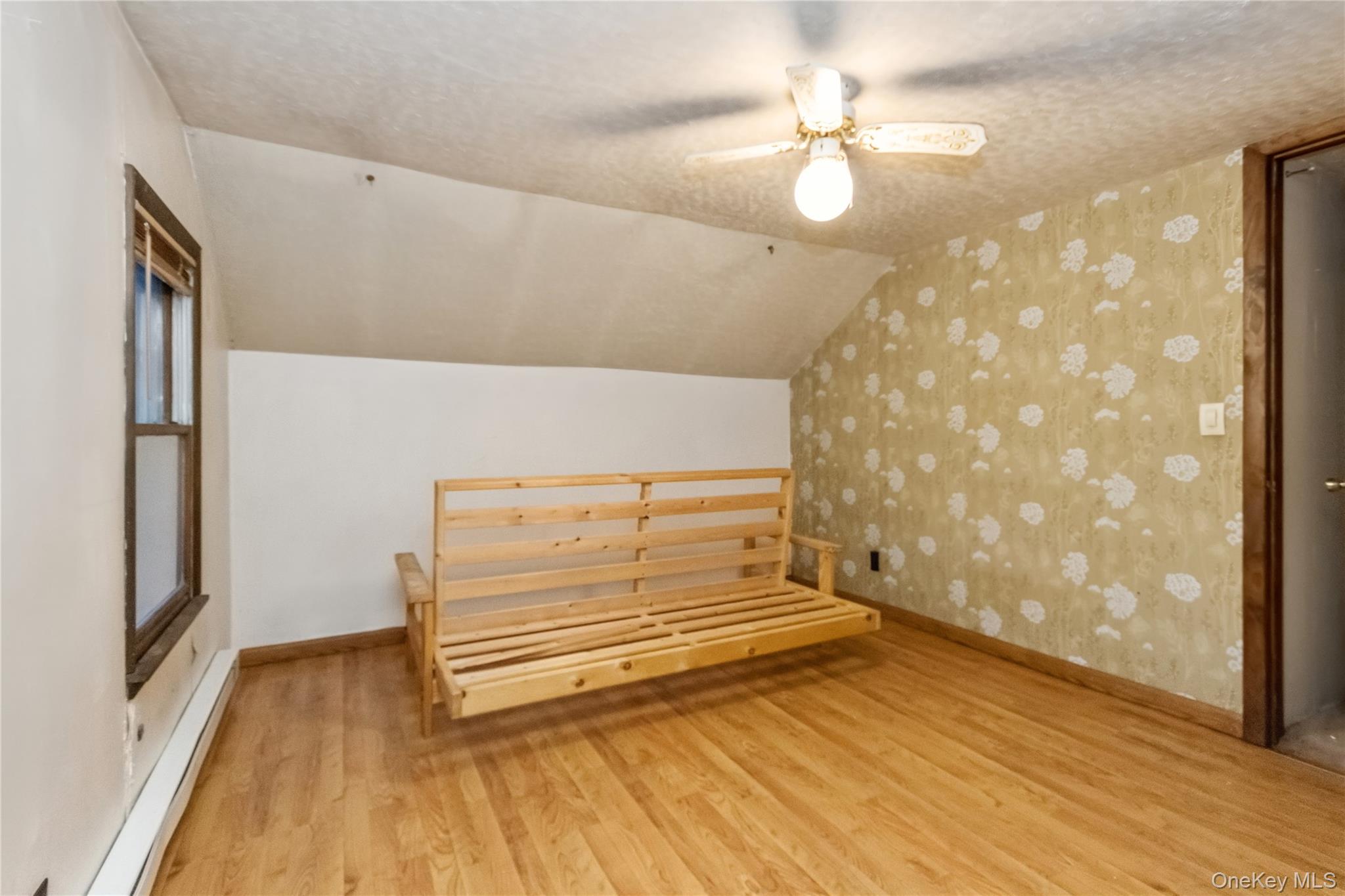 35 Fallkill Avenue Poughkeepsie, NY 12601 - Photo 24 of 27 a view of a room with wooden floor and a ceiling fan