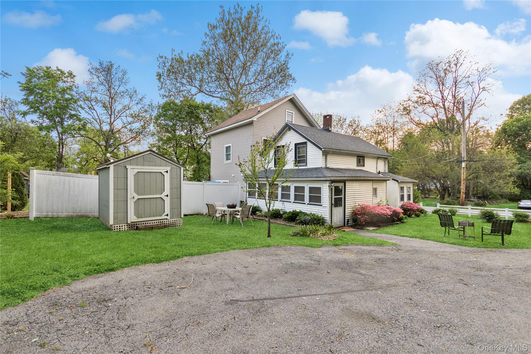 35 Fallkill Avenue Poughkeepsie, NY 12601 - Photo 7 of 27 a front view of a house with a garden and trees
