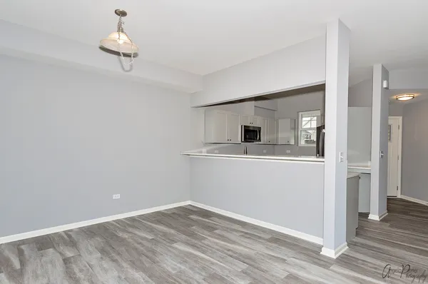 a view of a kitchen from the hallway