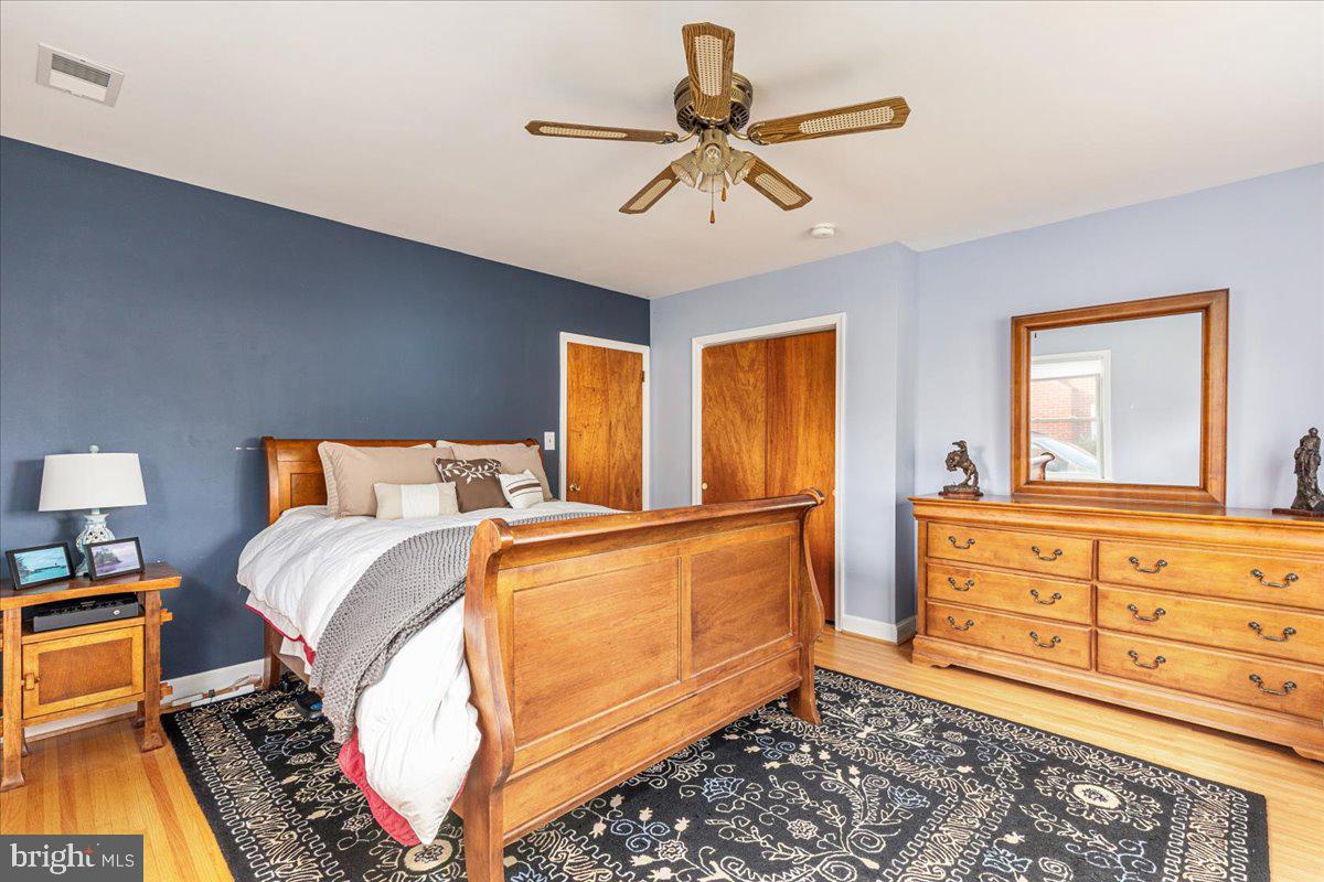 605 Happy Creek Road Front Royal, VA 22630 - Photo 11 of 19 a bed room with a bed and a chandelier