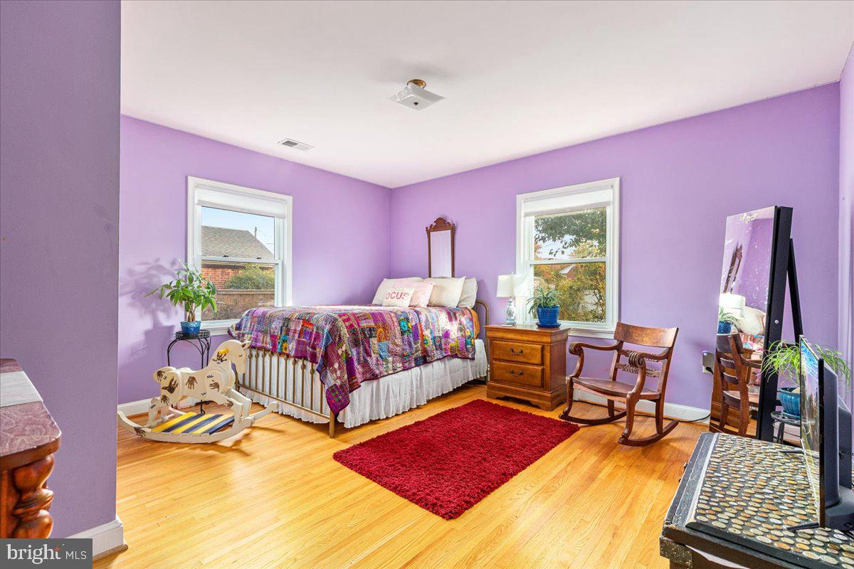 605 Happy Creek Road Front Royal, VA 22630 - Photo 12 of 19 a bedroom with a bed and wooden floor