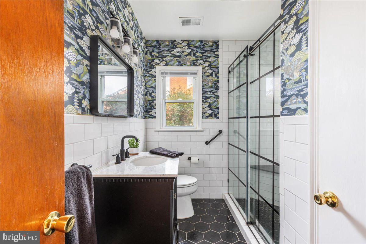 605 Happy Creek Road Front Royal, VA 22630 - Photo 14 of 19 a bathroom with a sink toilet and mirror