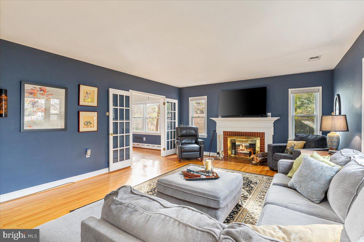 605 Happy Creek Road Front Royal, VA 22630 - Photo 4 of 19 a living room with furniture large window and a flat screen tv