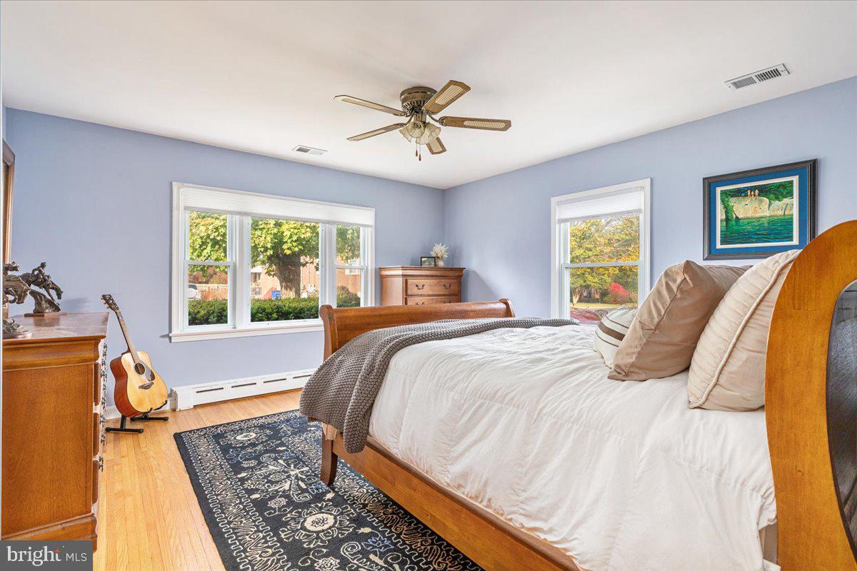 605 Happy Creek Road Front Royal, VA 22630 - Photo 10 of 19 a bedroom with a bed and wooden floor