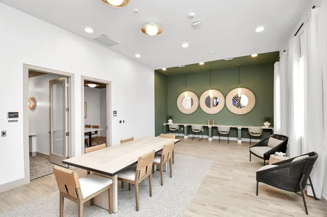 an open kitchen with a table and chairs