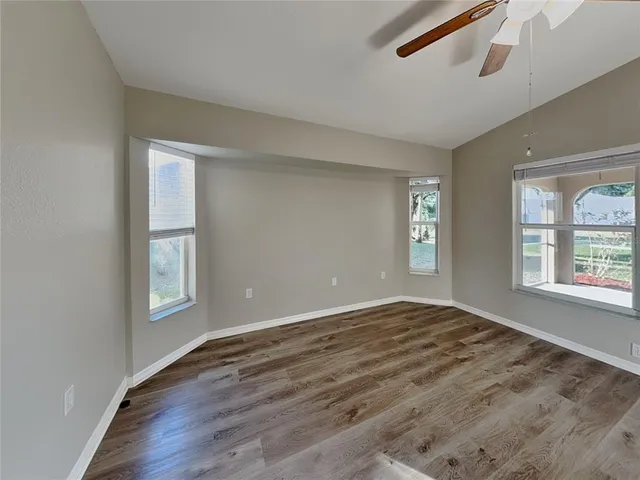 a view of an empty room with windows