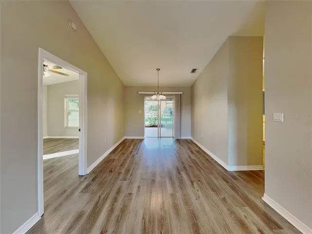 a view of gallery with wooden floor