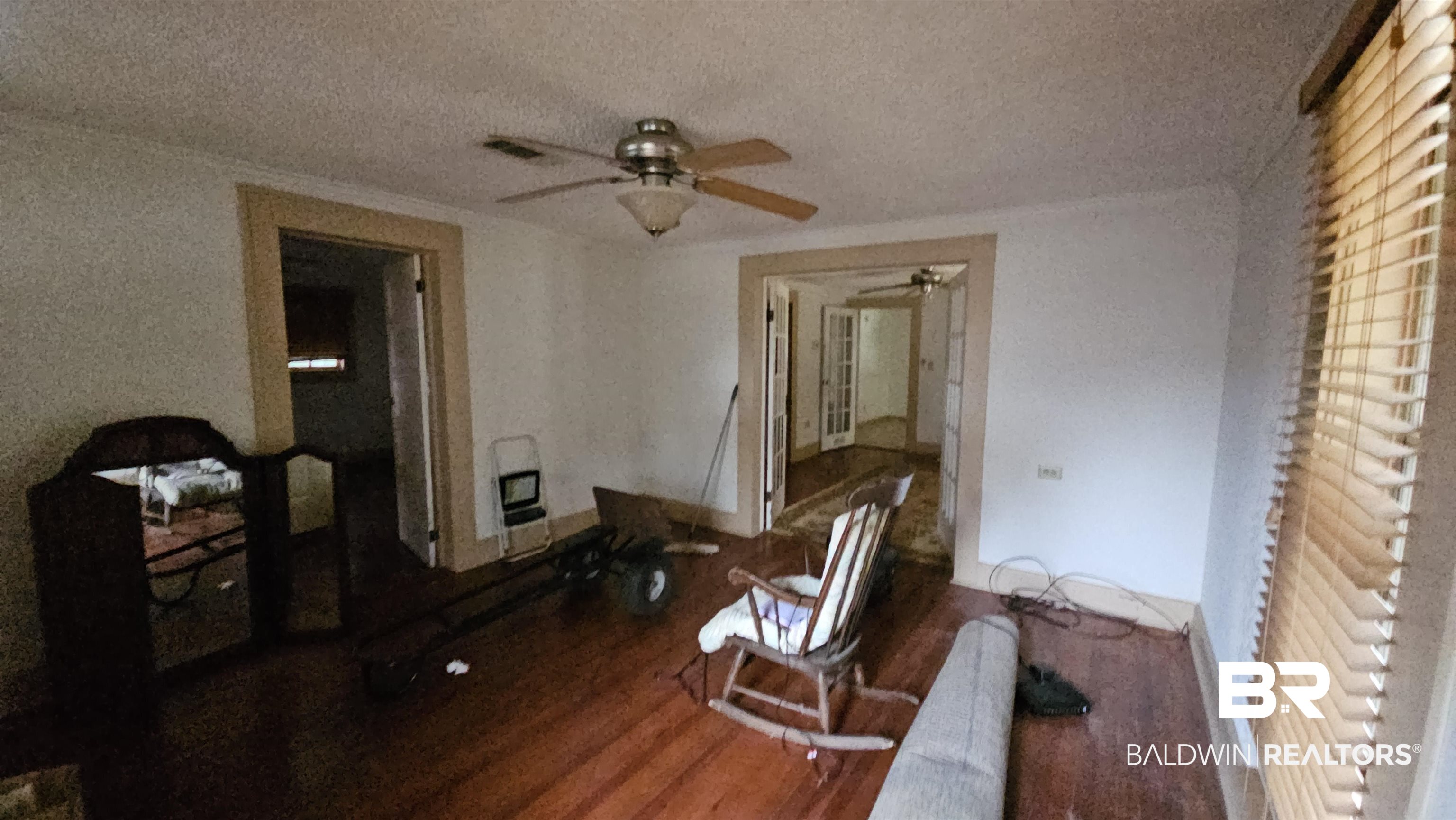307 Scott Street Brewton, AL 36426 - Photo 8 of 19 Interior space featuring hardwood / wood-style floors, a textured ceiling, heating unit, and ceiling fan