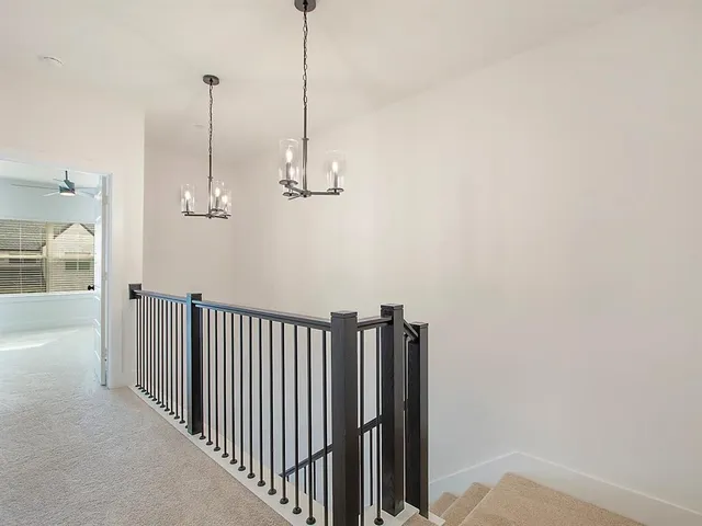 a view of a hallway with a chandelier