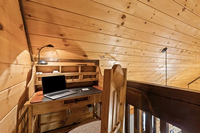 a view of a two chairs and table in the balcony