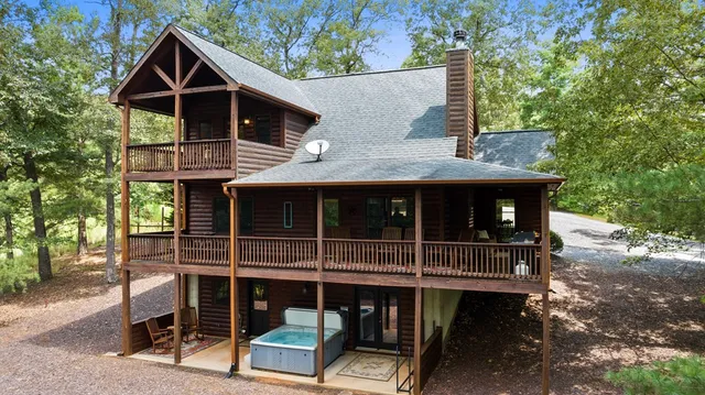 a balcony with table and chairs