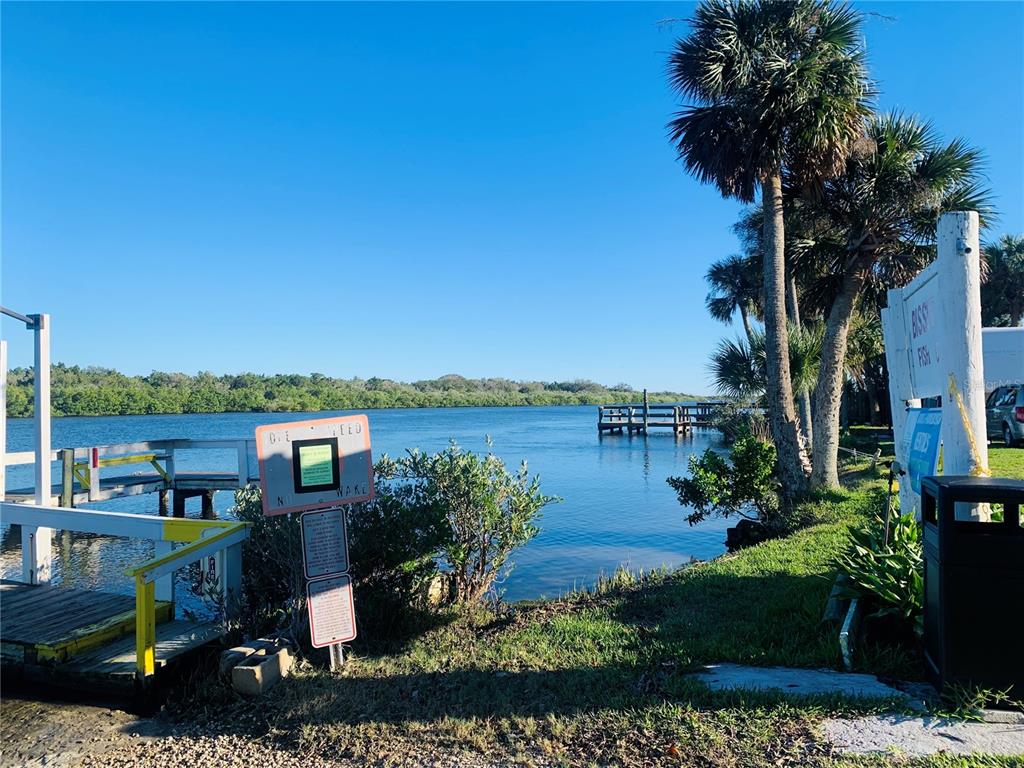 251 Bissit Bay Road Oak Hill, FL 32759 - Photo 4 of 9 a view of a house with a lake view