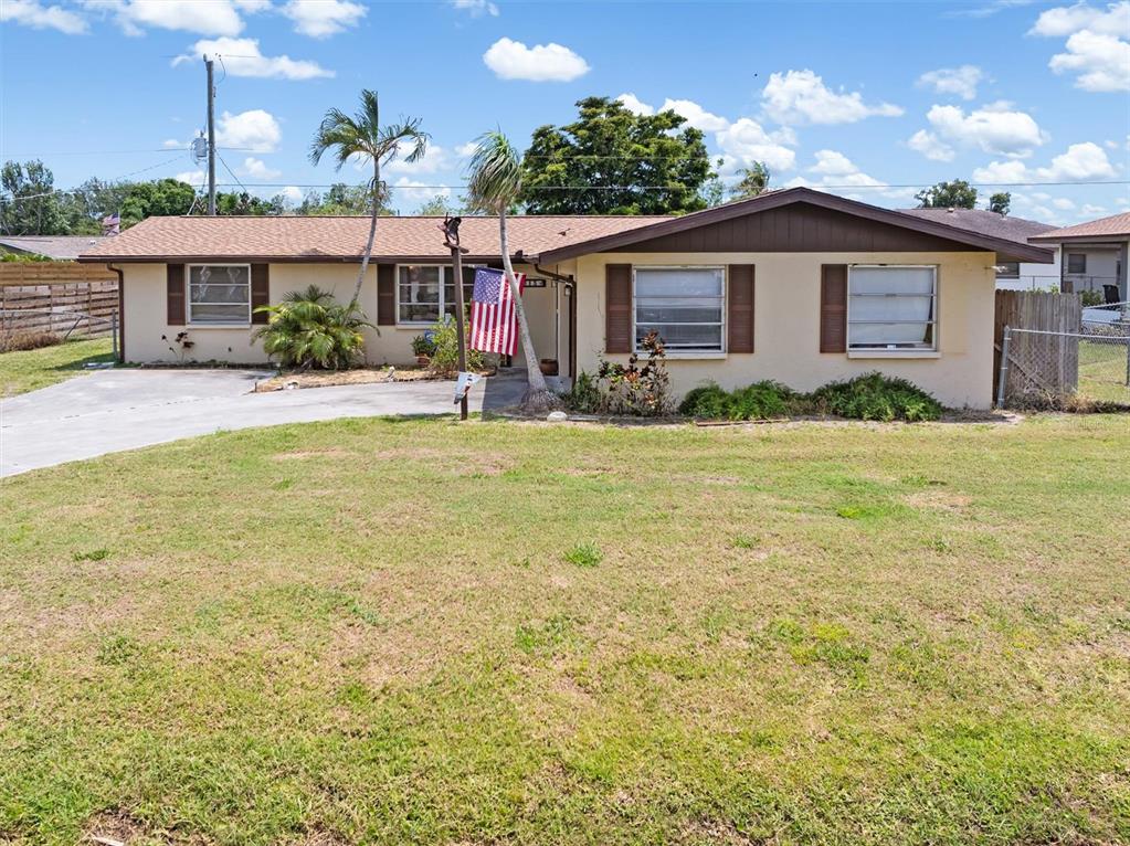 315 Holly Road Venice, FL 34293 - Photo 1 of 1 a view of a house with pool and a yard