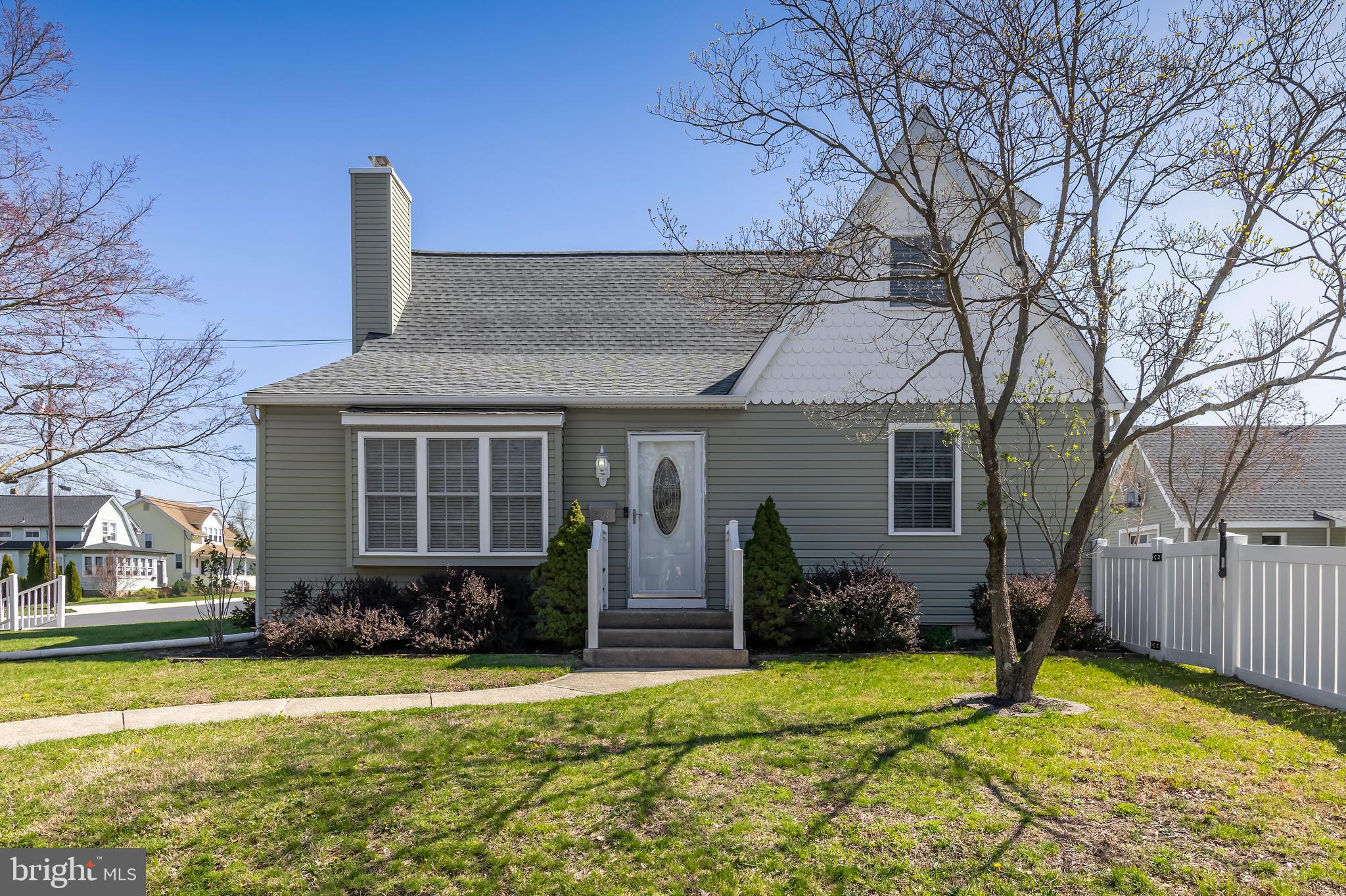 303 Main Street Mantua, NJ 08051 - Photo 1 of 48 a front view of house with yard outdoor seating and barbeque oven
