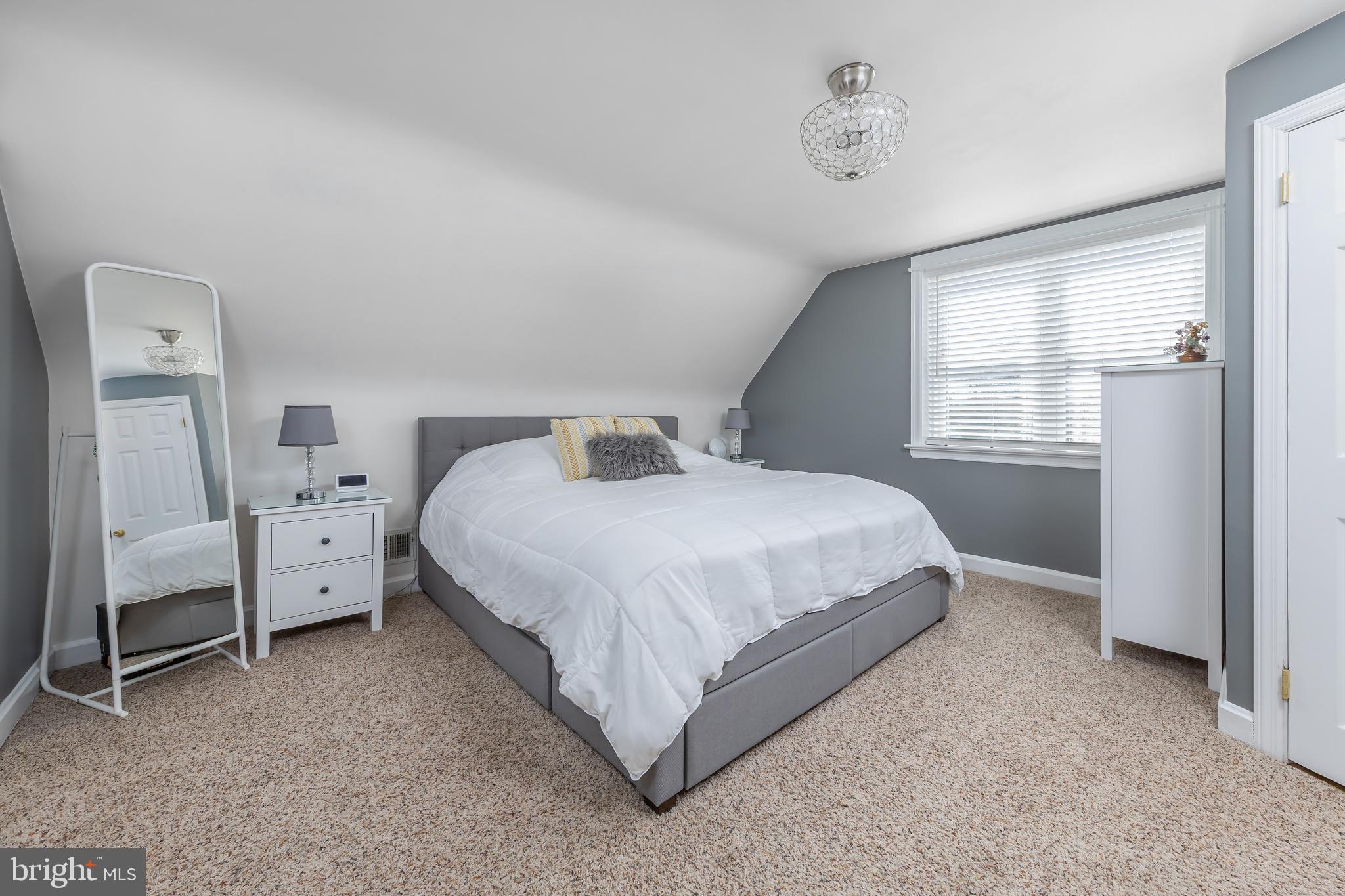 303 Main Street Mantua, NJ 08051 - Photo 14 of 48 a bed room with a bed and a chair