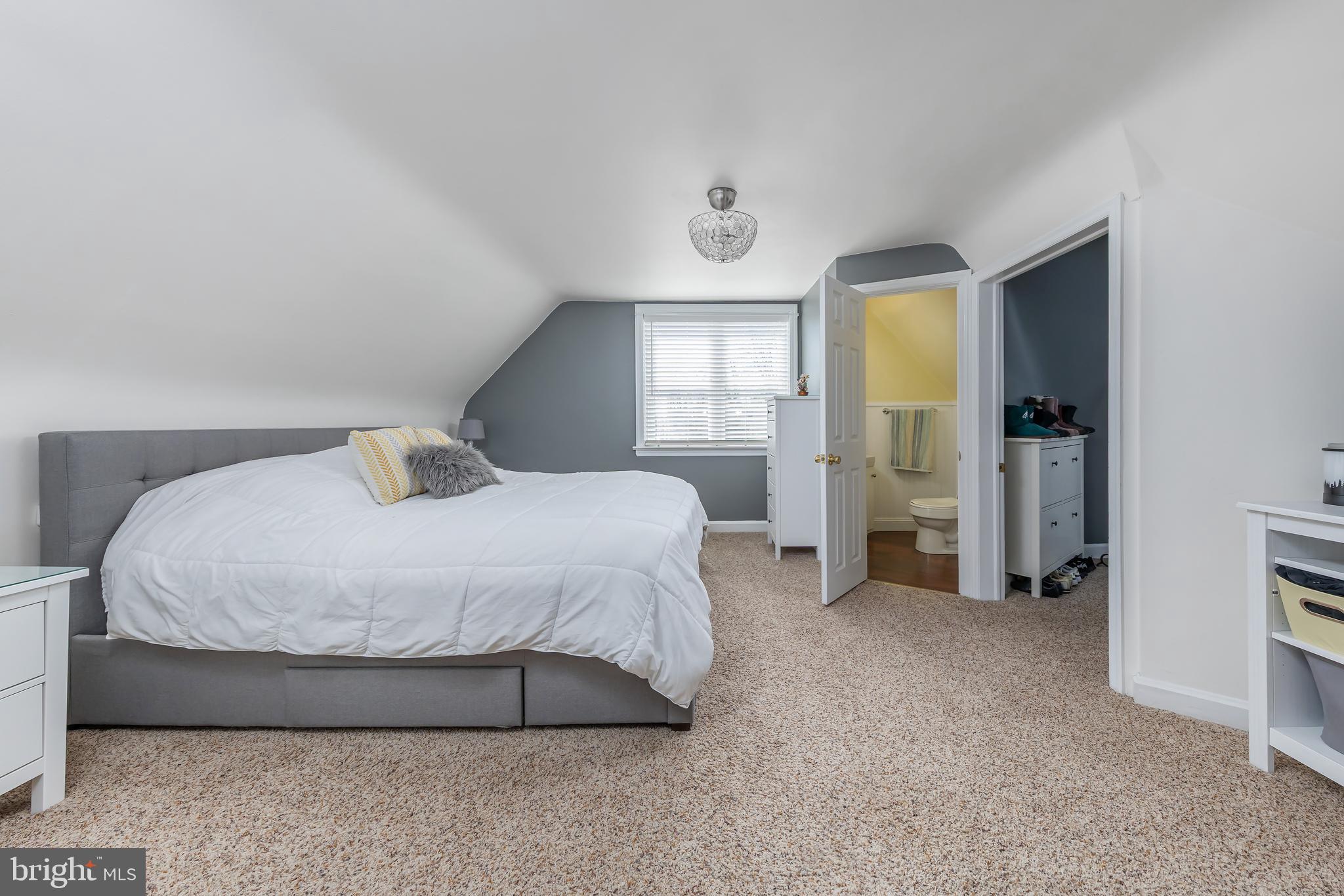 303 Main Street Mantua, NJ 08051 - Photo 15 of 48 a bedroom with a bed and a refrigerator