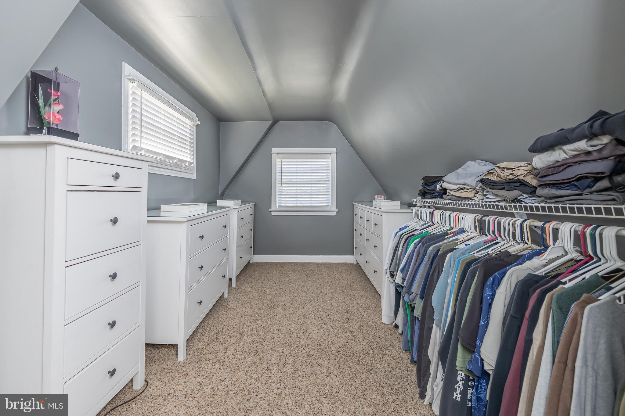 303 Main Street Mantua, NJ 08051 - Photo 16 of 48 a view of walk in closet with clothes and shoes