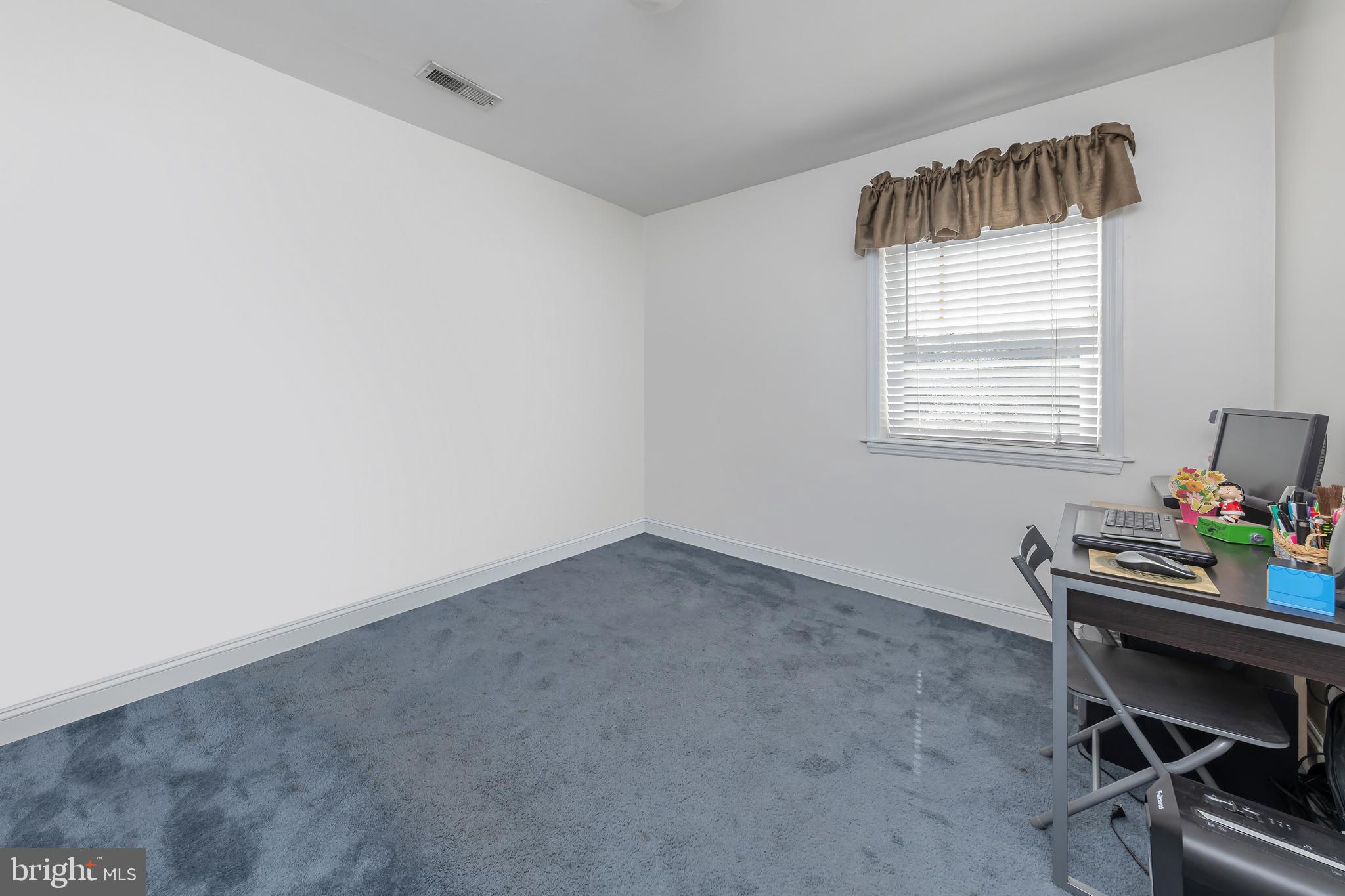 303 Main Street Mantua, NJ 08051 - Photo 18 of 48 a room with a workspace