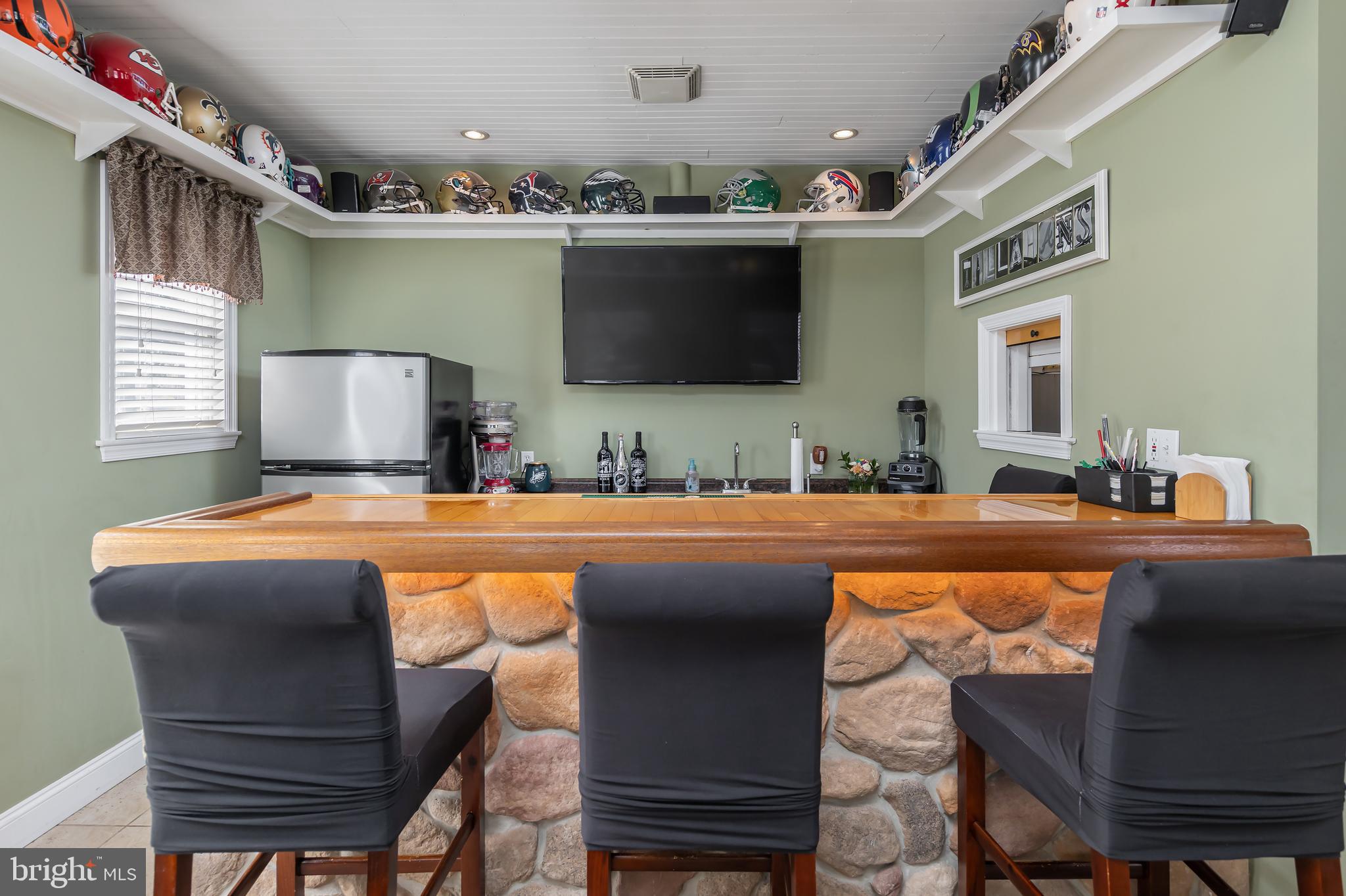 303 Main Street Mantua, NJ 08051 - Photo 10 of 48 a bedroom with a bed a lamp and a flat screen tv