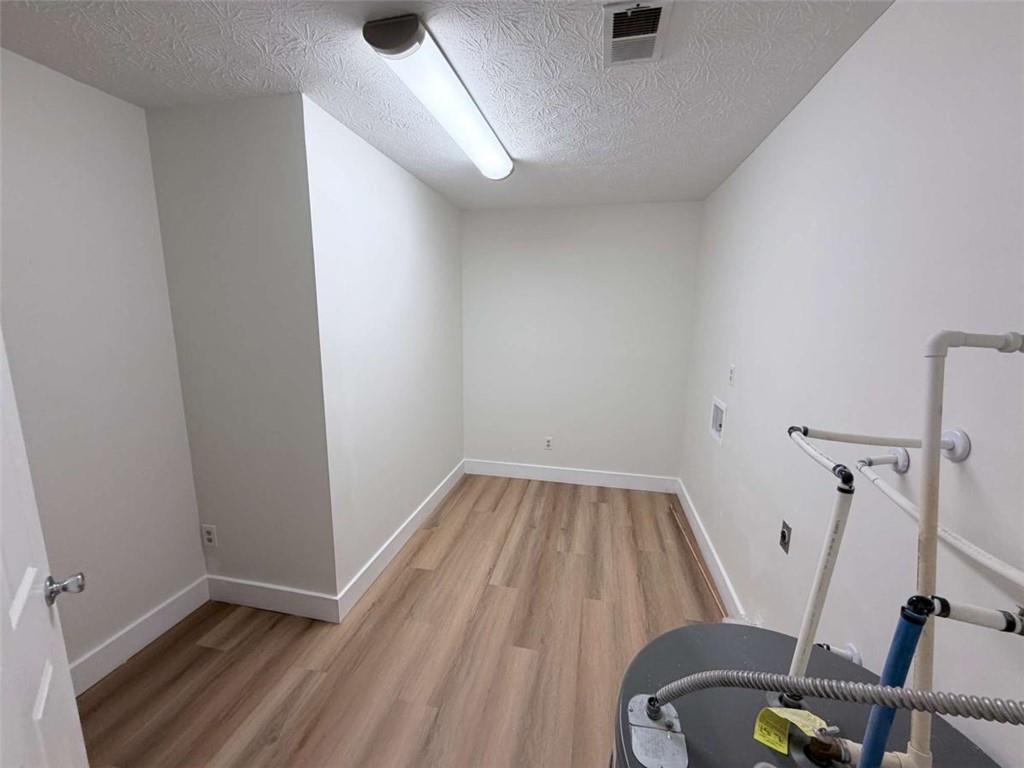 185 Roberts Road Covington, GA 30016 - Photo 14 of 25 a view of a room with wooden floor