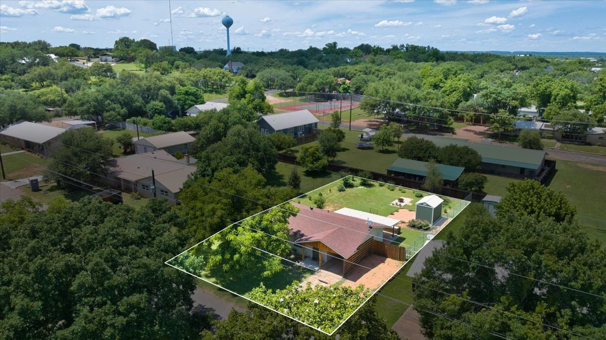 1236 Martin Street Mason, TX 76856 - Photo 39 of 40 An aerial perspective reveals a private residence nestled amidst verdant landscaping.