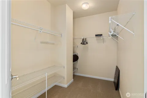 a bedroom with a bed and a television