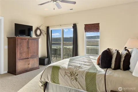 a bedroom with two beds and a window